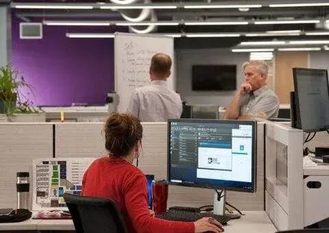 One Legal colleagues working in the office