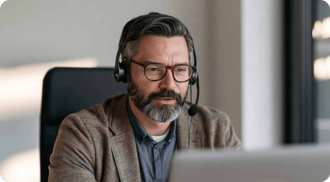 Legal professional wearing a headset while working at a computer
