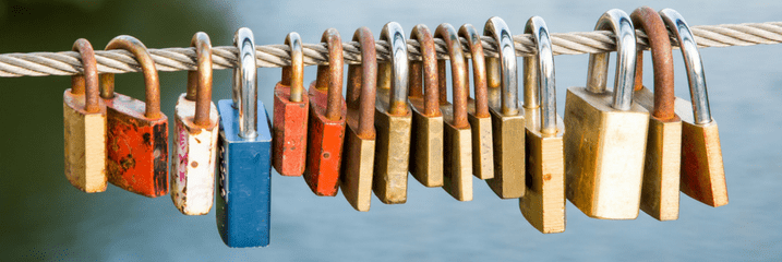 padlocks hanging on a wire