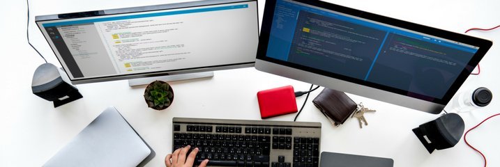 Two computer monitors on a desk