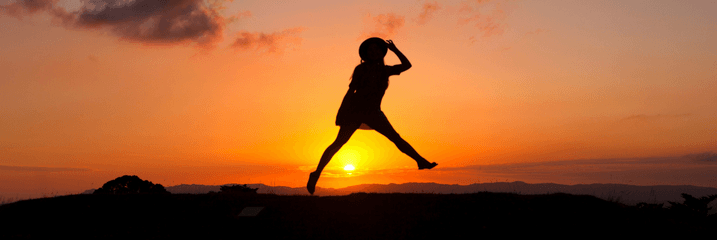 person jumping sunset