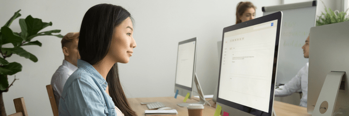 woman staring at computer