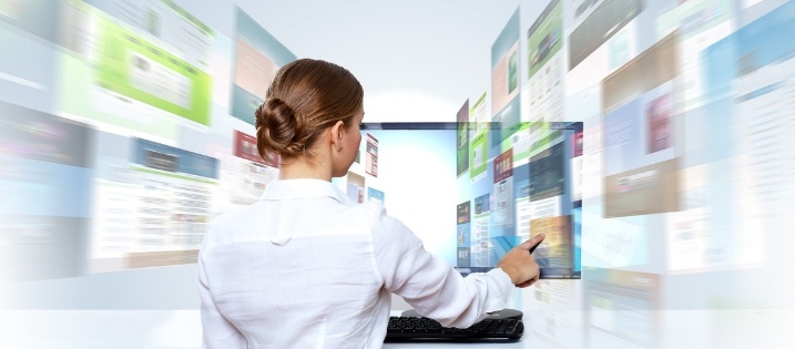 woman working on digital screens