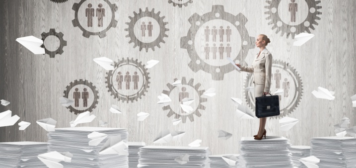 woman standing on top of court documents with statistics logos above her