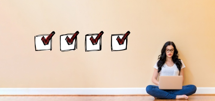 Woman on laptop checklist