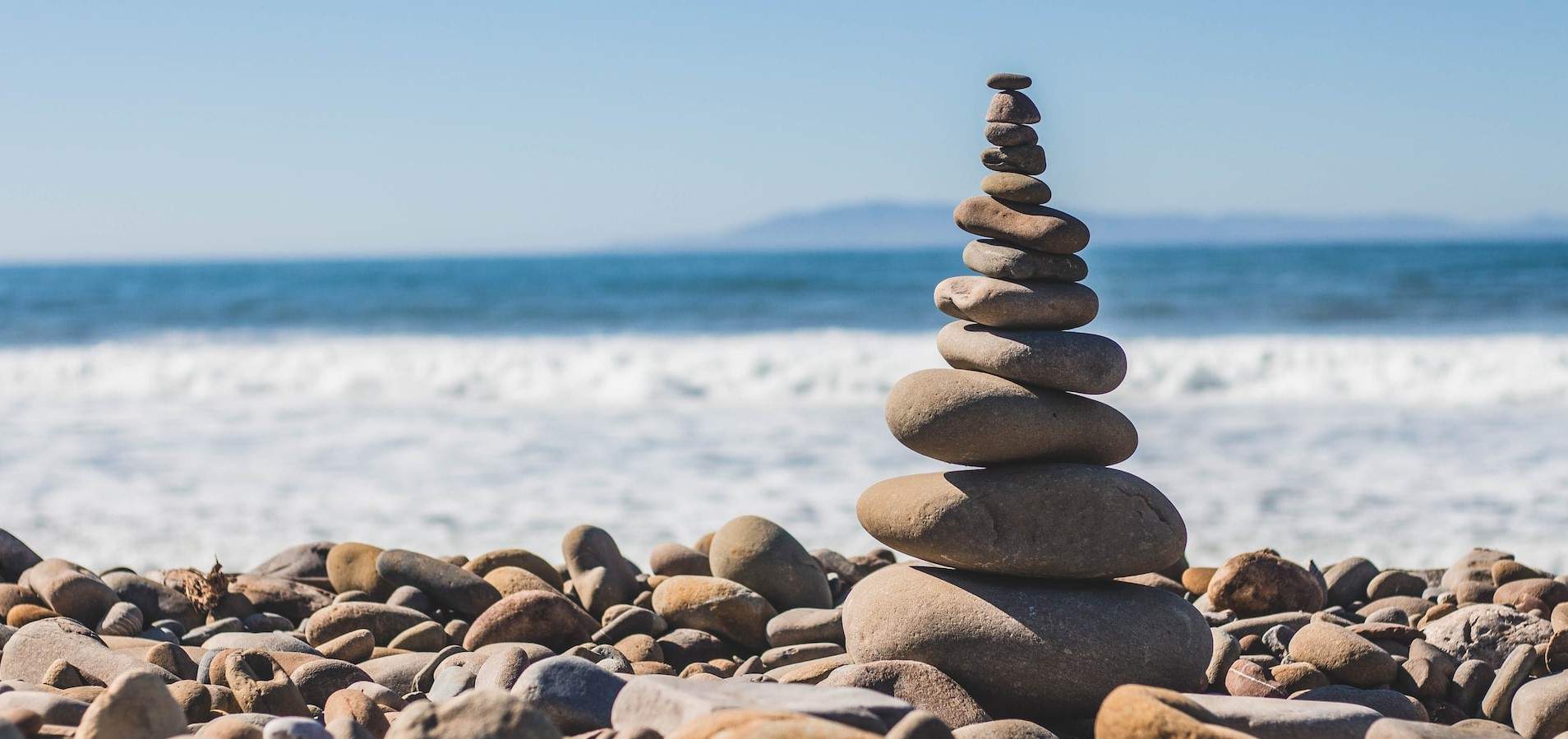 Photo of a stack of rocks representing balance for an article on wellness resources for California legal professionals